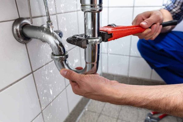 plumber-rates-fixing-sink-pipe-Featured